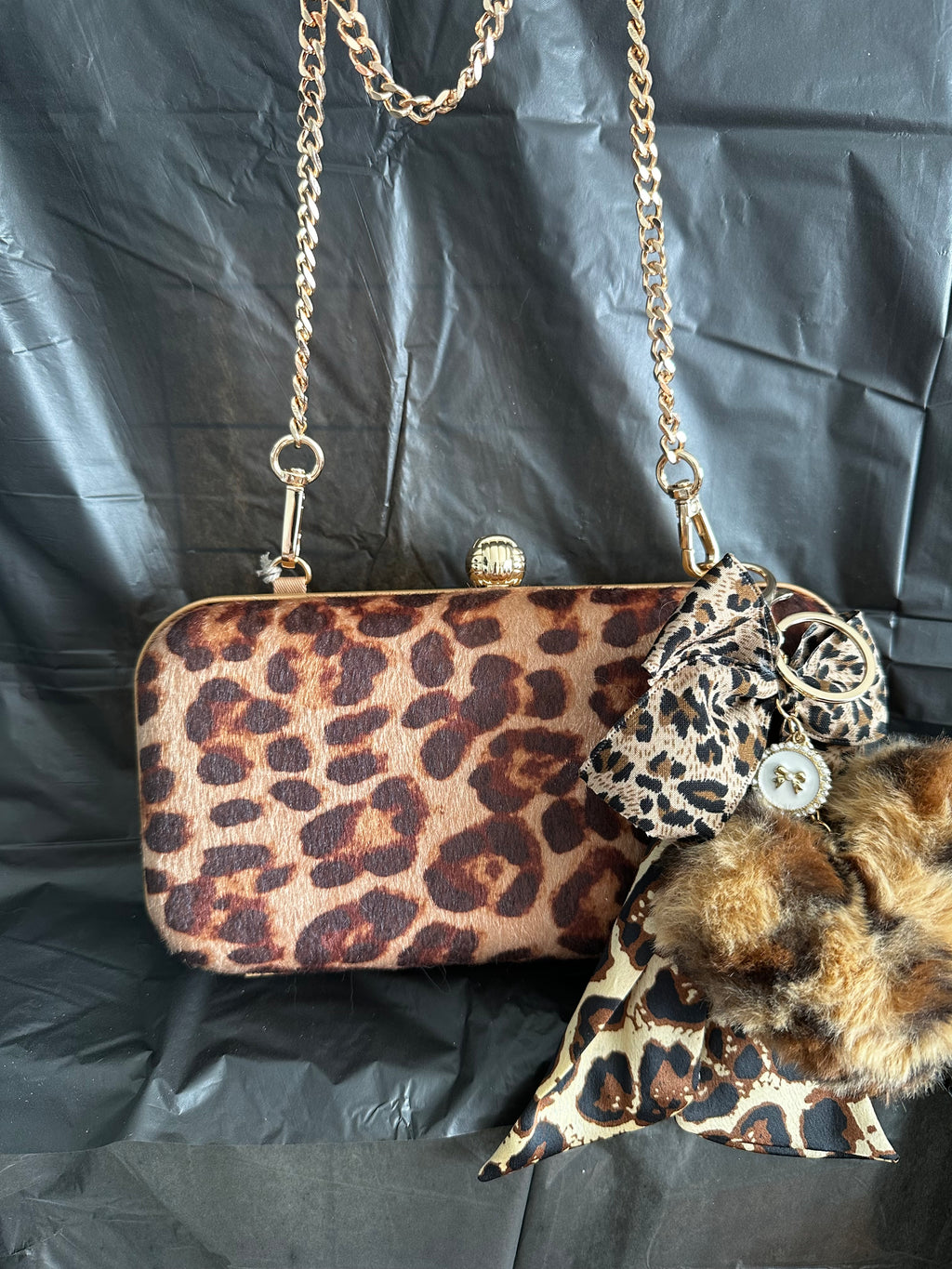 Brown Leopard Print Clutch with Gold-Tone Chain & Pom-Pom Charm