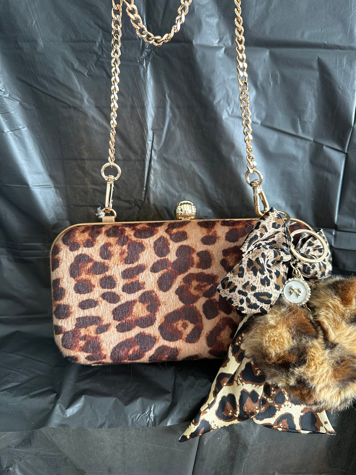 Brown Leopard Print Clutch with Gold-Tone Chain & Pom-Pom Charm