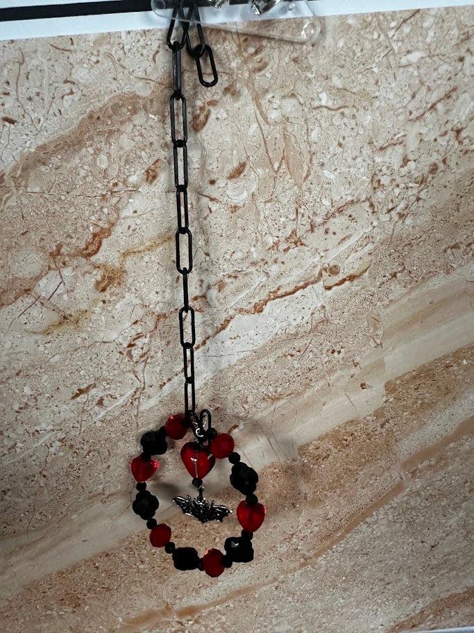 Sara’s Suncatchers – Red Glass & Lava Bat Visor Charm